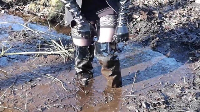 Vinyl over knee boots, pantyhose and mini skirt in deep mud!